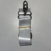 A white strap with yellow thread and metal rings.