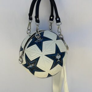 A white and black soccer ball purse hanging on the wall.